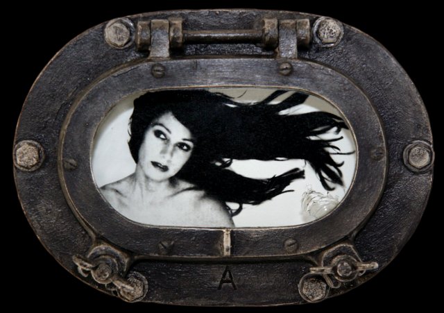 Gothic Mermaid.jpg - "Gothic Mermaid" 10 x 7 x 3" inches Mixed Media on Brass Porthole W/Metal Bolts, Photograph  Photograph Developed by Jennifer Hart Biagiotti  2008