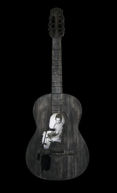 Broken Song and Beauty .JPG - “Broken Song and Beauty”   15 x 39 x 4”    Mixed Media on Burnt Guitar, Photograph   Photograph Shot & Developed by Jennifer Hart Biagiotti  2008     